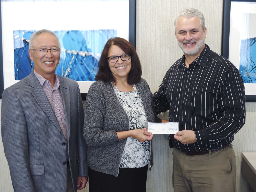 AT&T Presents check to the American Indian College Fund President, Cheryl Crazy Bull.