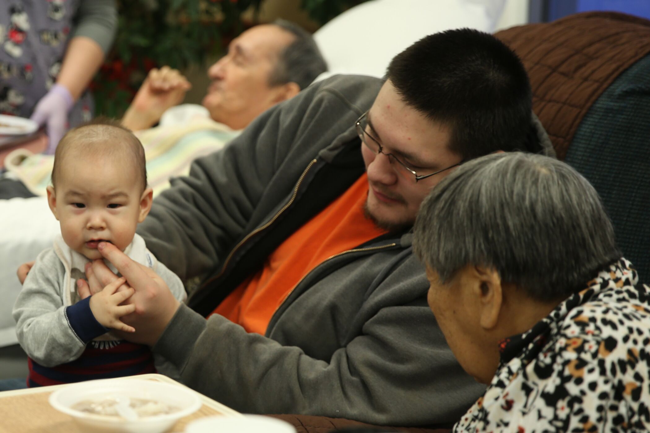 Iñupiat elder residents from the Aimaaġvik Assisted Living Center enjoyed the potluck and created meaningful connections across generations.